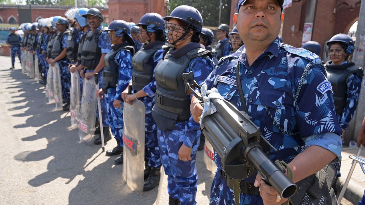 Personnel from the Indian Rapid Action Force (RAF) patrol along a street in Amritsar on May 10, 2023. 