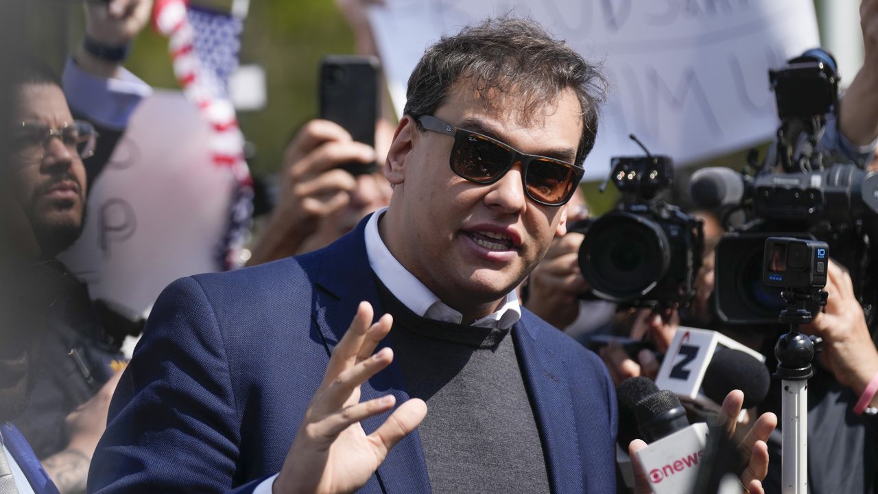 Rep. George Santos speaks to reporters outside of the federal courthouse in Central Islip, New York, on Wednesday, May 10, 2023.