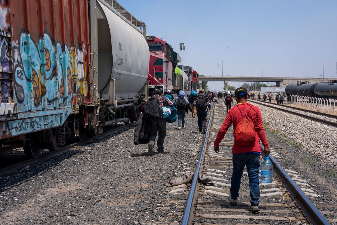 ‘You can’t sleep here:’ On board a perilous freight train with families ...