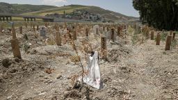 A dress at an unmarked grave in Narlıca cemetery, in the earthquake zone in Turkey.