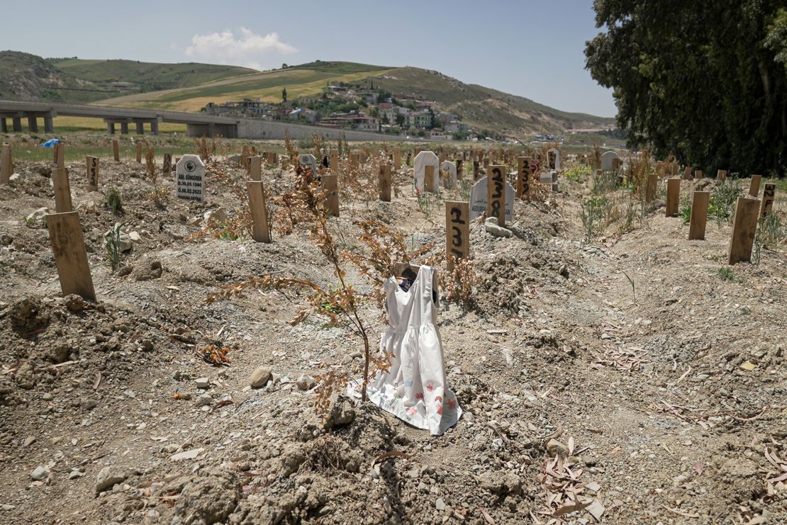 Thousands of people are still unaccounted for from Turkey's earthquake. Sometimes gravediggers will place belongings of the deceased on an unmarked grave to provide a clue for loved ones searching for them. In Narlıca cemetery, the wooden plank on grave number 236 is draped with a child's white dress. 
