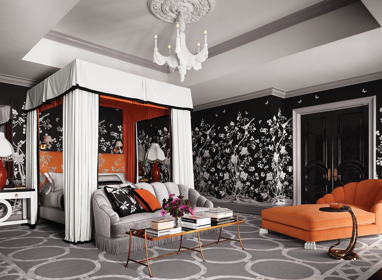Orange is the drag icon's favorite color and appears in velvet, lacquer or painted accents through the home.