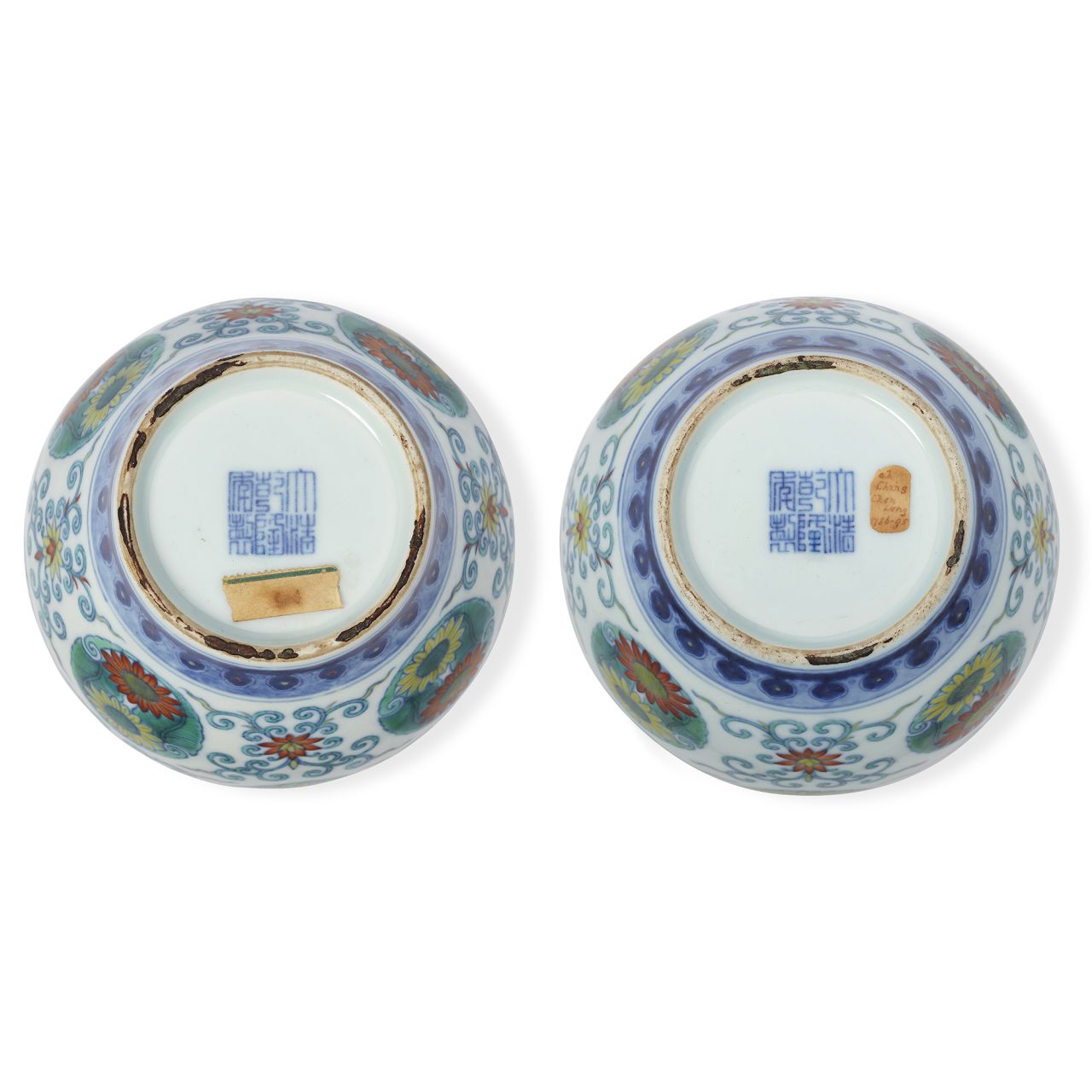 The "Qianlong" seals on the base of the jars.