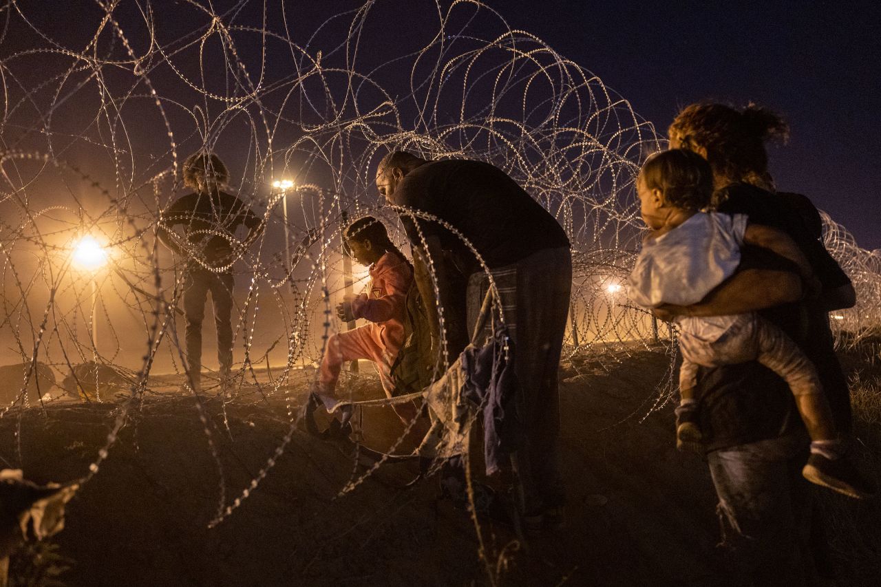 Migrant families cross into El Paso, Texas, from Mexico on Monday, May 8.