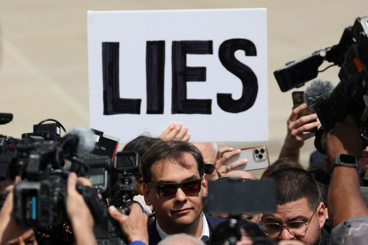 US Rep. George Santos leaves a federal courthouse in Central Islip, New York, on Wednesday, May 10. <a href="https://www.cnn.com/2023/05/10/politics/george-santos-indicted-arrested/index.html" target="_blank">Santos pleaded not guilty</a> to 13 federal charges, including allegations of fraud related to Covid-19 unemployment benefits, misusing campaign funds and lying about his personal finances on House disclosure reports. He was released on a $500,000 bond, according to the US Attorney's Office in New York.