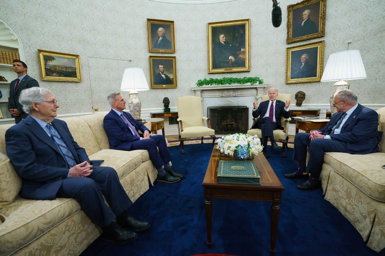 US President Joe Biden, second from right, meets with, from left, Senate Minority Leader Mitch McConnell, House Speaker Kevin McCarthy and Senate Majority Leader Chuck Schumer in the White House Oval Office on Tuesday, May 9. They emerged from their <a href="https://www.cnn.com/2023/05/09/politics/biden-mccarthy-debt-ceiling-white-house-meeting/index.html" target="_blank">hour-long meeting</a> with little to show that they're moving toward a deal to raise the debt ceiling and avoid a default that would have catastrophic economic consequences.