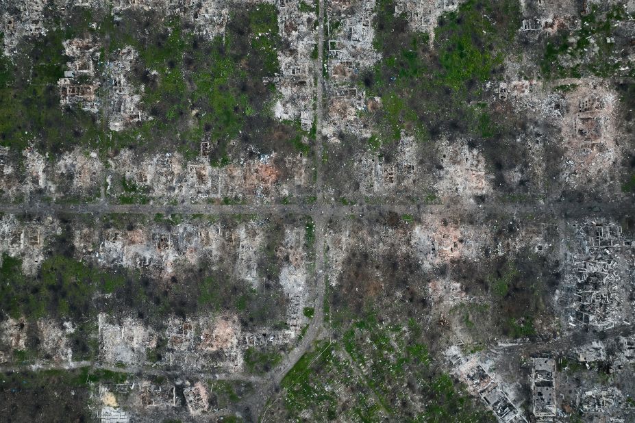 This aerial photo, taken on Thursday, May 11, shows shell craters and residential buildings razed to the ground in Maryinka, Ukraine. Heavy battles have been taking place there between Ukraine and Russia.