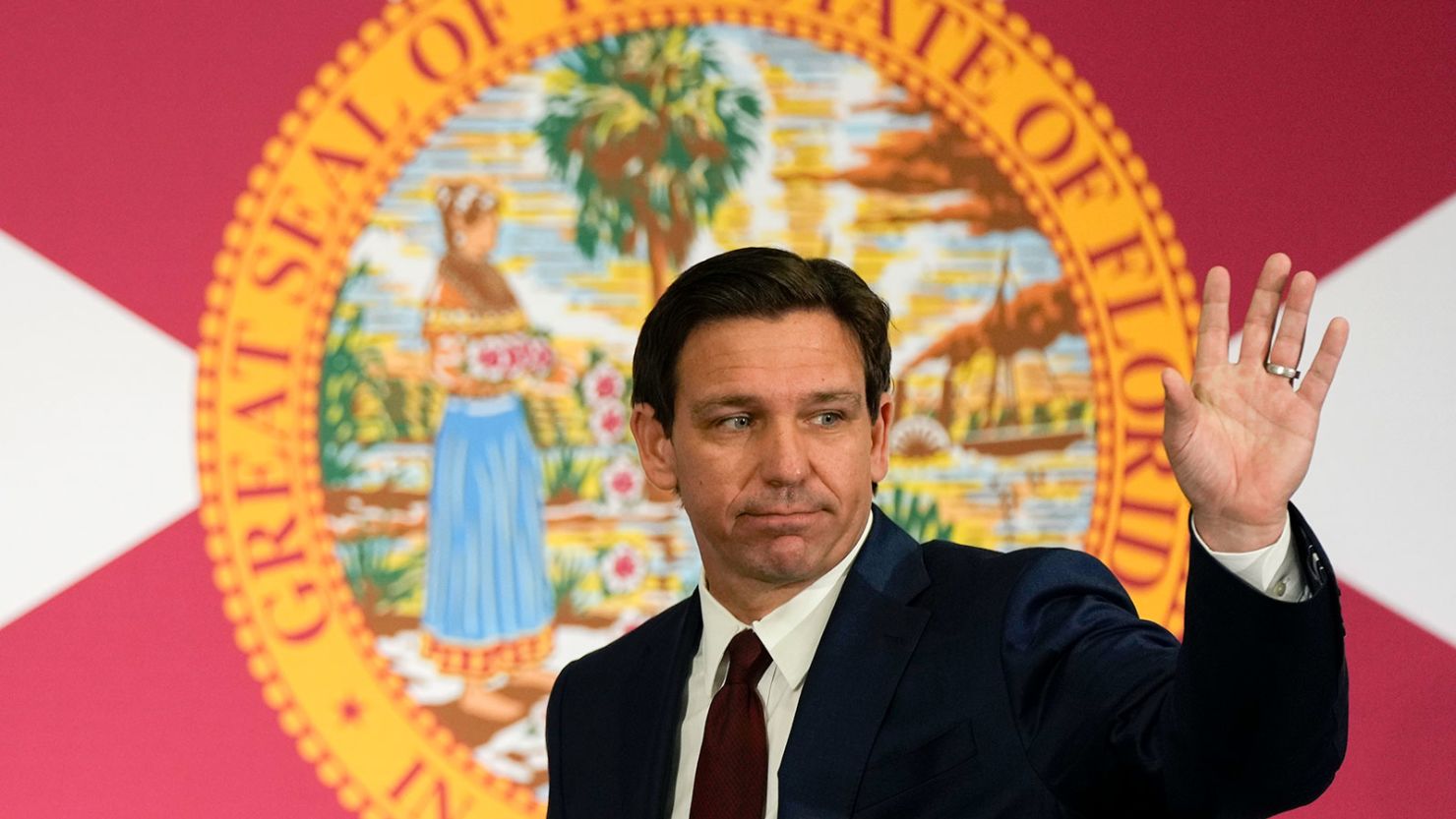 Florida Governor Ron DeSantis waves as he leaves after signing several bills related to public education and teacher pay, at a press conference in Miami, May 9, 2023.