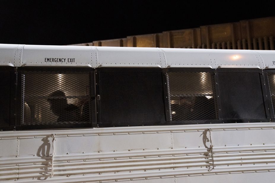 Migrants board a bus after surrendering to US Border Patrol agents in Yuma on May 11.