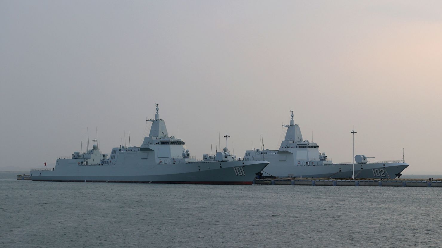 Type 055 guided-missile destroyers Nanchang (101) and Lhasa (102) at China's Qingdao port on  April 20, 2023.