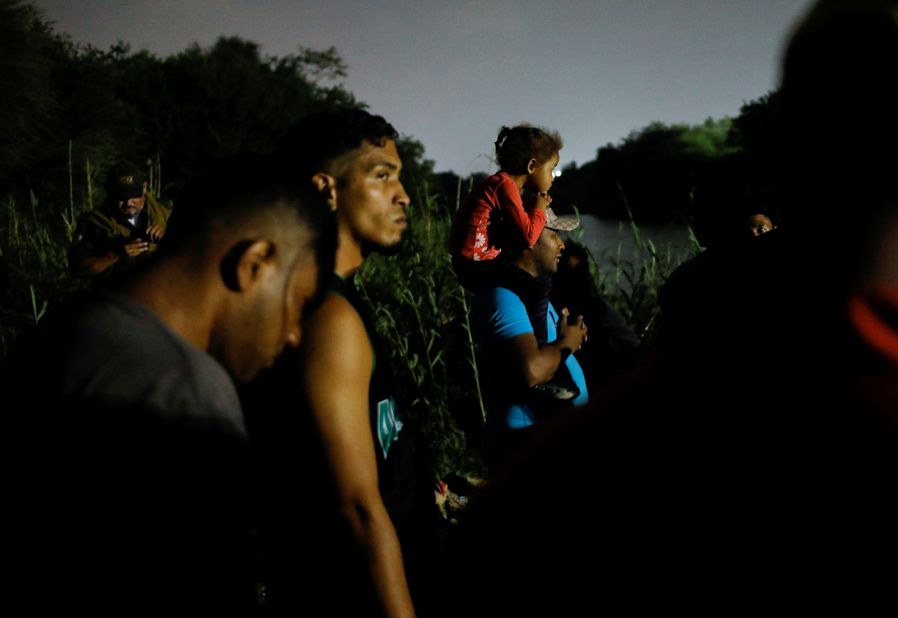 Migrants in Matamoros, Mexico, gather on the banks of the Rio Grande as they get ready to cross the border to turn themselves in on May 11.