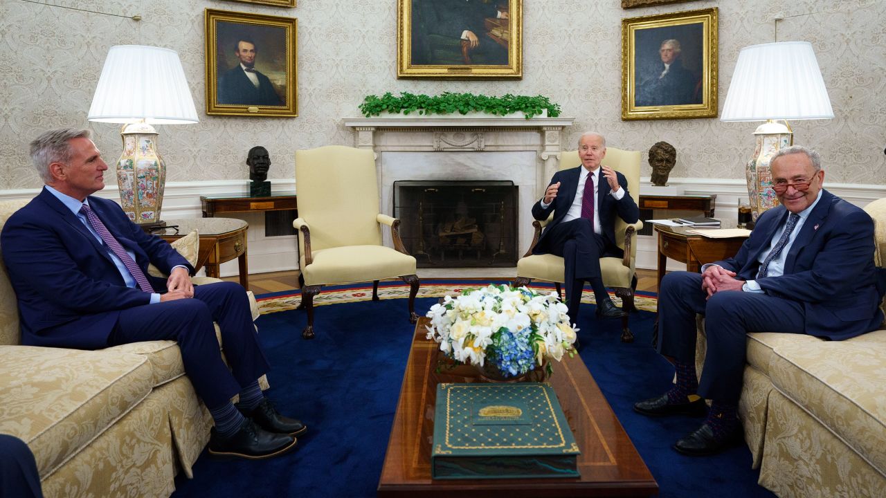 House Speaker Kevin McCarthy and Senate Majority Leader Chuck Schumer listen as President Joe Biden before a meeting on the debt limit in the Oval Office of the White House on Tuesday in Washington, DC. 