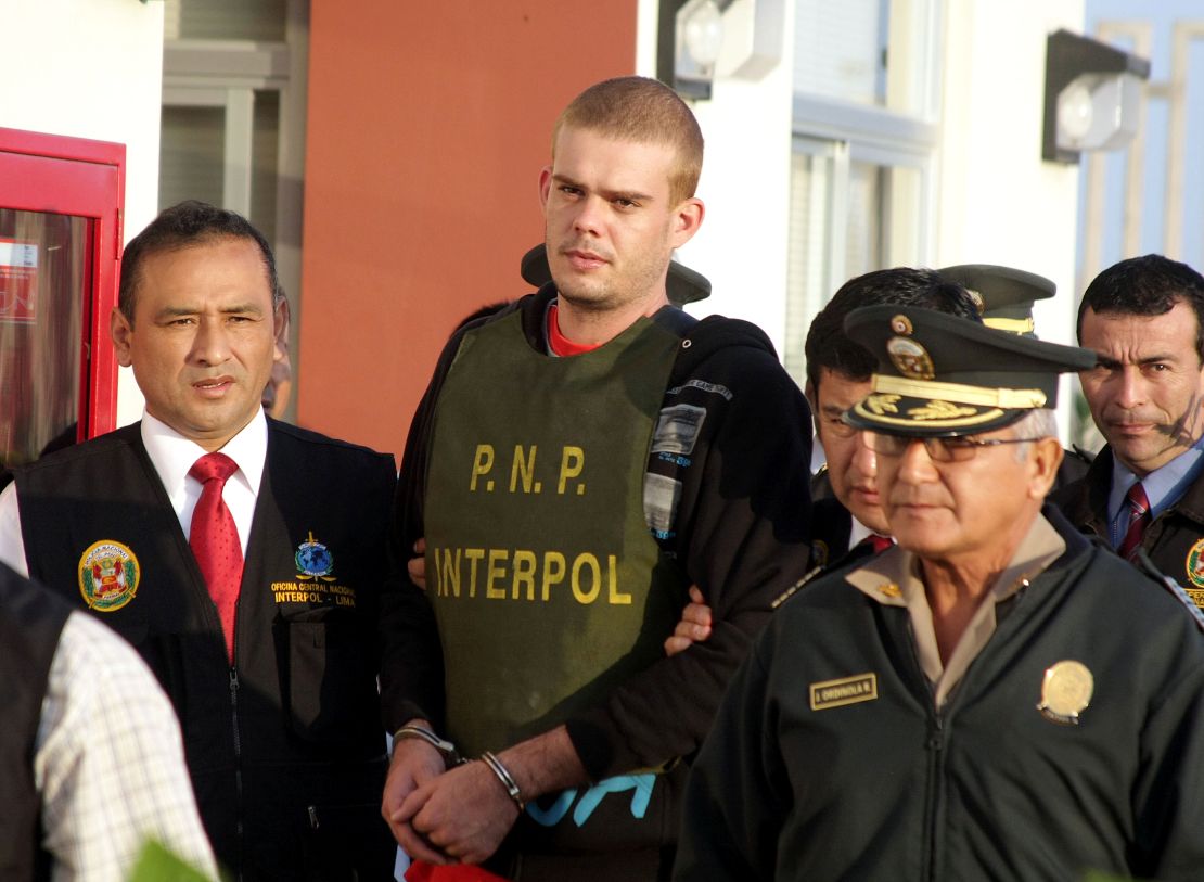 Joran van der Sloot, center, is escorted by Peruvian police June 4, 2010, after Chilean authorities handed him over.