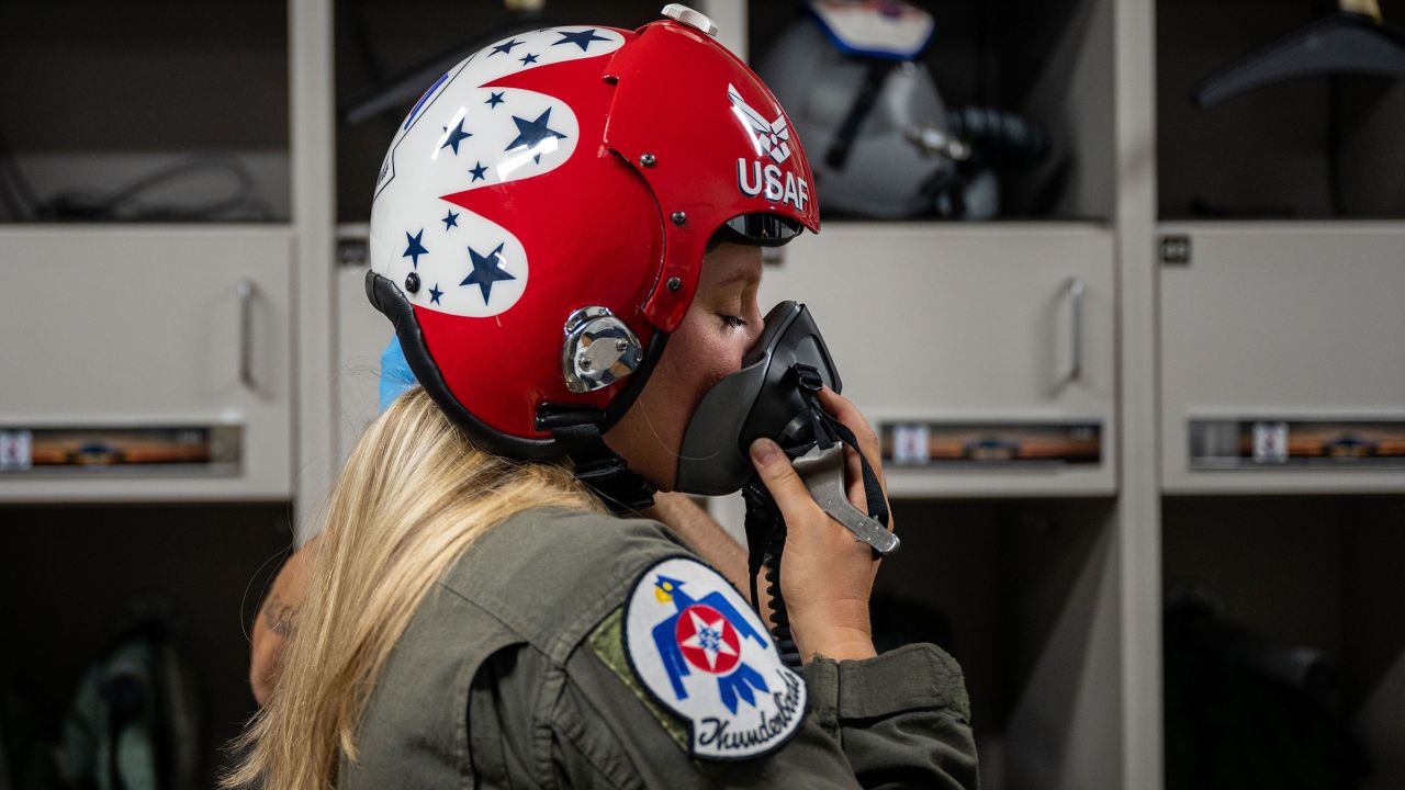 Britzky practiced putting on his oxygen mask in preparation for his flight.  During air show performances, Thunderbird will fly two F-16 C and D block models, which, while differing in seating capacities, both can reach speeds of up to 1,500 miles per hour and altitude of 50,000 feet.