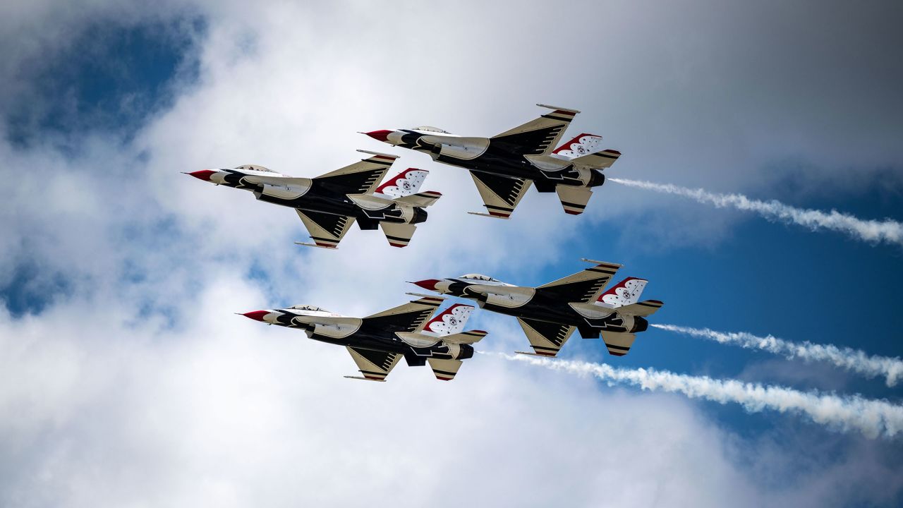 US Air Force Thunderbird F-16D Fighting Falcons fly in a diamond formation.