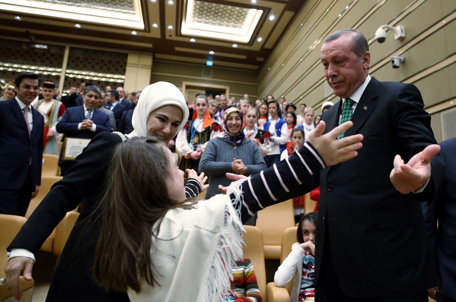 Erdogan greets a child at the Presidential Palace as part of a children's festival in Ankara in April 2015.
