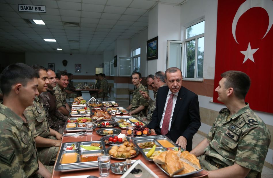 Erdogan breaks his Ramadan fast with soldiers he was visiting in Mardin, Turkey, in June 2016.