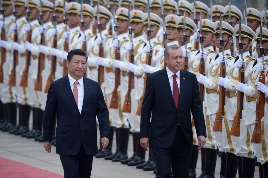 Erdogan and Chinese President Xi Jinping inspect honor guards during a welcome ceremony outside the Great Hall of the People in Beijing in July 2015.