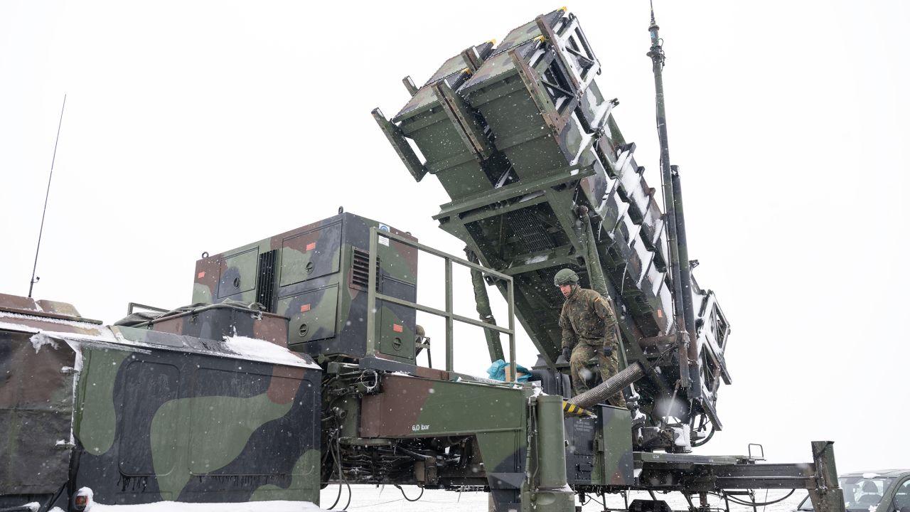 In this file photo, a soldier stands on a trailer with launching pads for guided missiles of the Patriot air defense system in southeastern Poland.