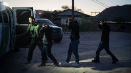 A group of men from El Salvador are detained by U.S. Border Patrol agents after crossing from Mexico early Friday near Sunland Park, N.M., May 12, 2023. Some people tried last-minute crossings, but most of the border was quiet as U.S. officials prepared for the days ahead as Title 42 was lifted. (Todd Heisler/The New York Times)