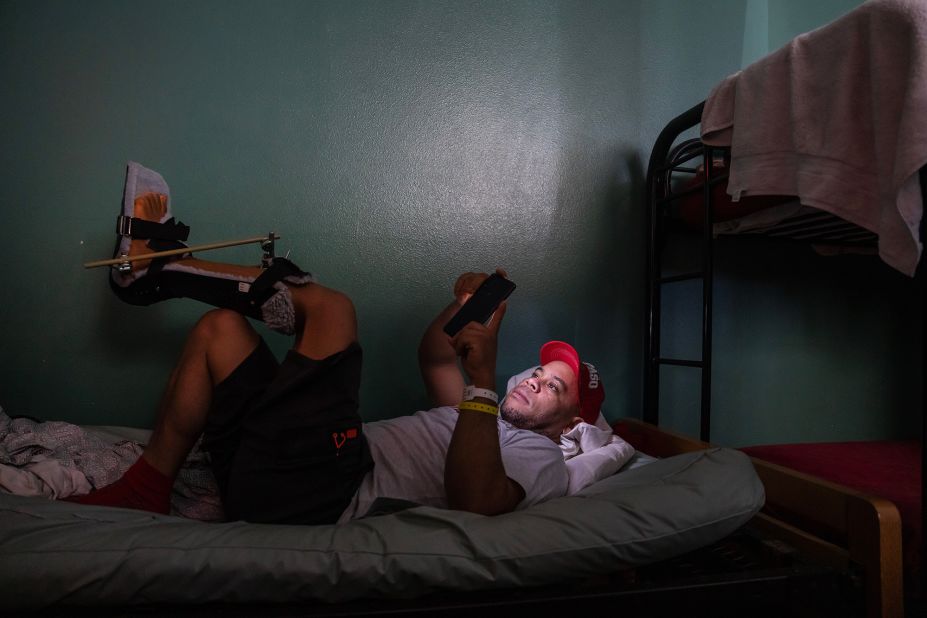 Merejido Del Orbe, who came to the United States from the Dominican Republic, rests at Annunciation House, a shelter in El Paso, Texas, on May 11. He broke his leg when he slipped from a rope while climbing a border fence in April.