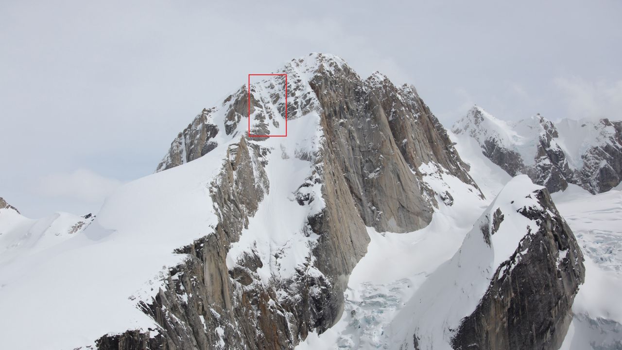West Ridge of the Moose's Tooth, Denali National Park and Preserve. The red box, added by the National Park Service, indicates the vicinity of the boot tracks that lead into a small avalanche area.