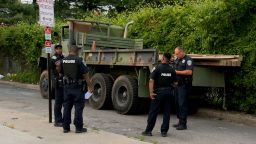 Police surround a privately-owned military vehicle in Baltimore City, Maryland, after a suspect was taken into custody for allegedly stealing the five-ton vehicle and leading officers on a highway chase.