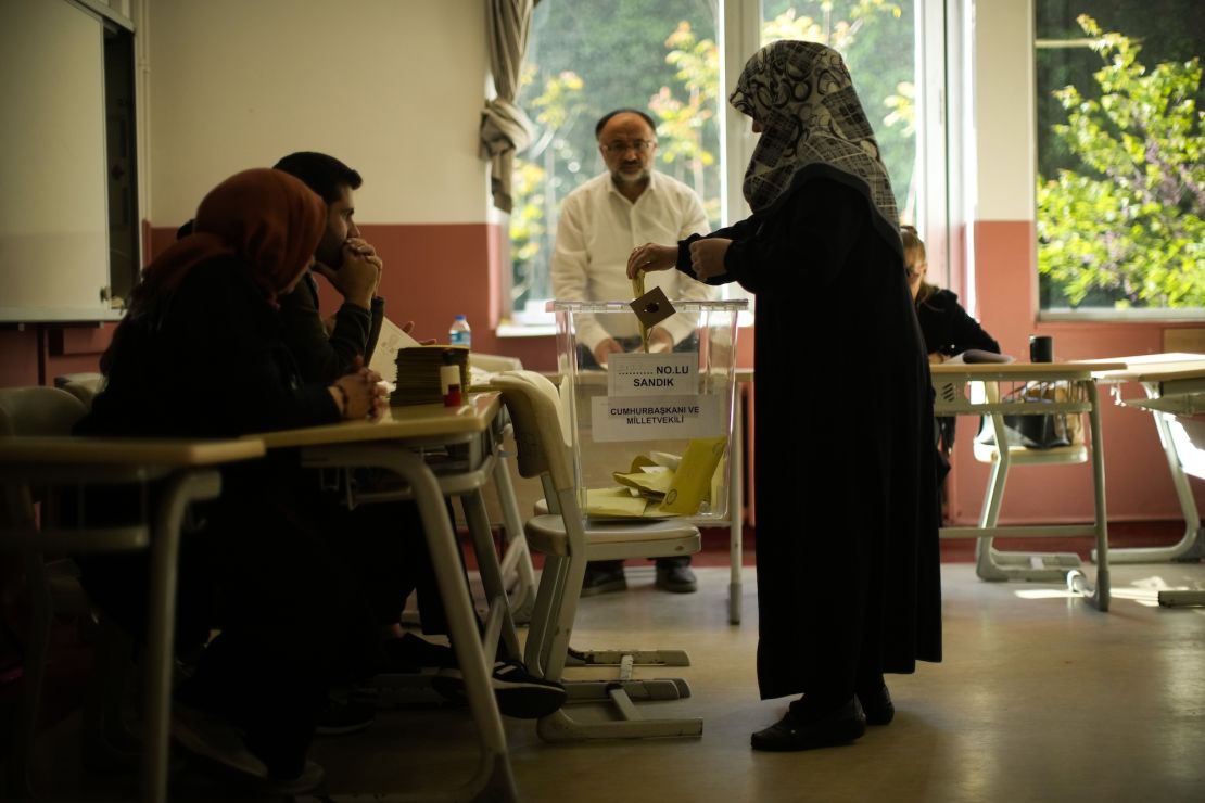 A woman votes at a polling station in Istanbul.