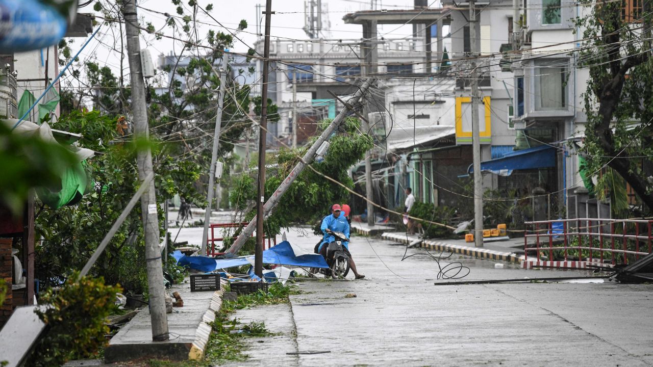 Residents on a damaged street after Cyclone Mocha in Kyauktaw, Myanmar's Rakhine state, on May 14.