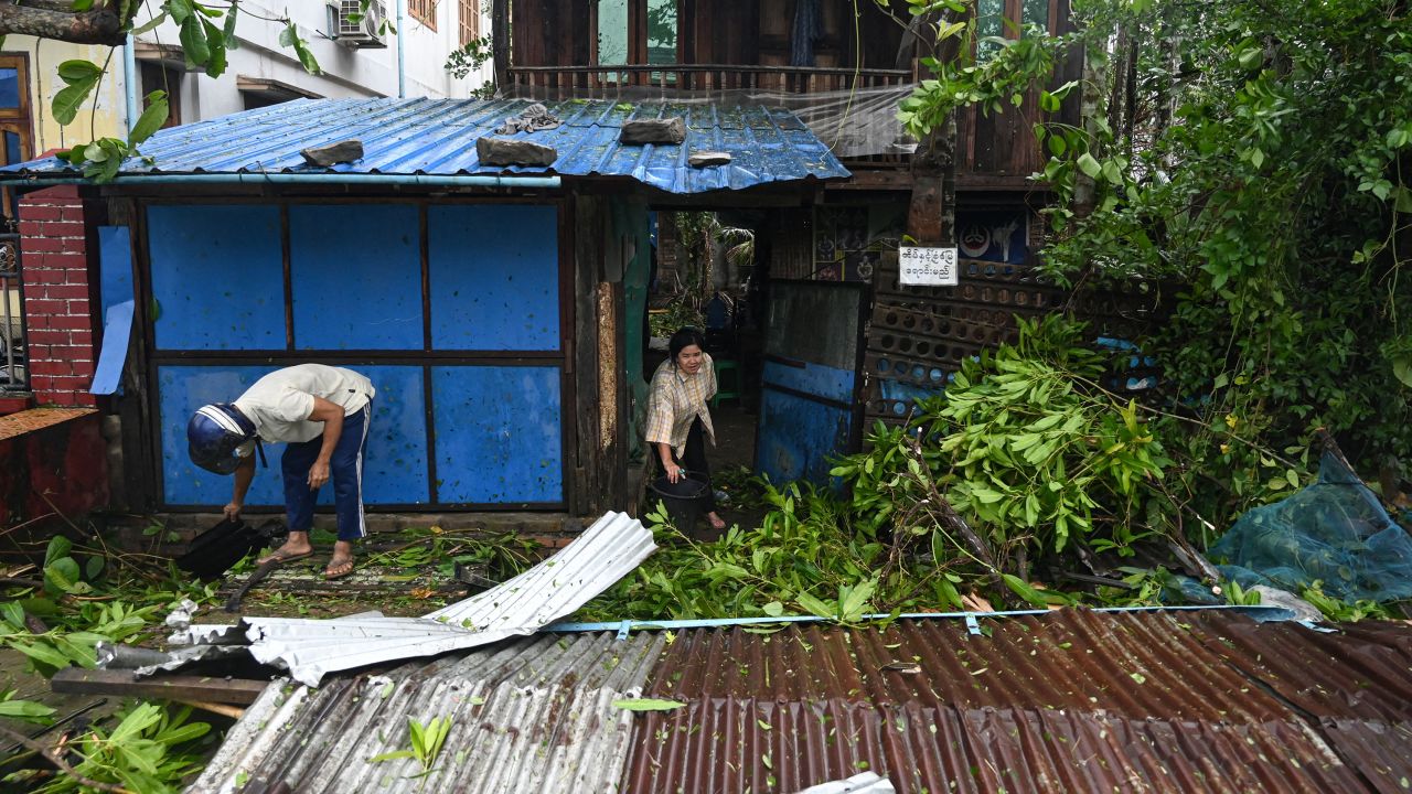 Local residents check the damages after Cyclone Mocha's crashed ashore in Kyauktaw in Myanmar's Rakhine state on May 14, 2023. 