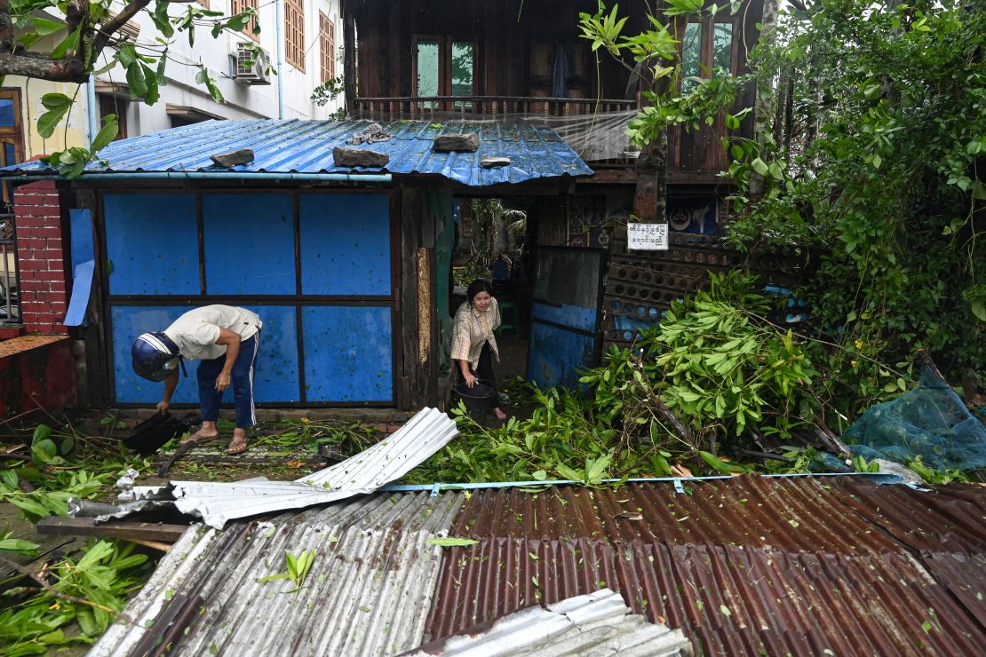 Local residents check the damages after Cyclone Mocha's crashed ashore in Kyauktaw in Myanmar's Rakhine state on May 14, 2023. 