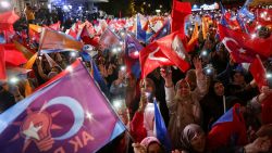 Supporters of Turkish President Tayyip Erdogan wave flags outside the AK Party headquarters in Ankara, Turkey, on May 15. Umit Bektas/Reuters