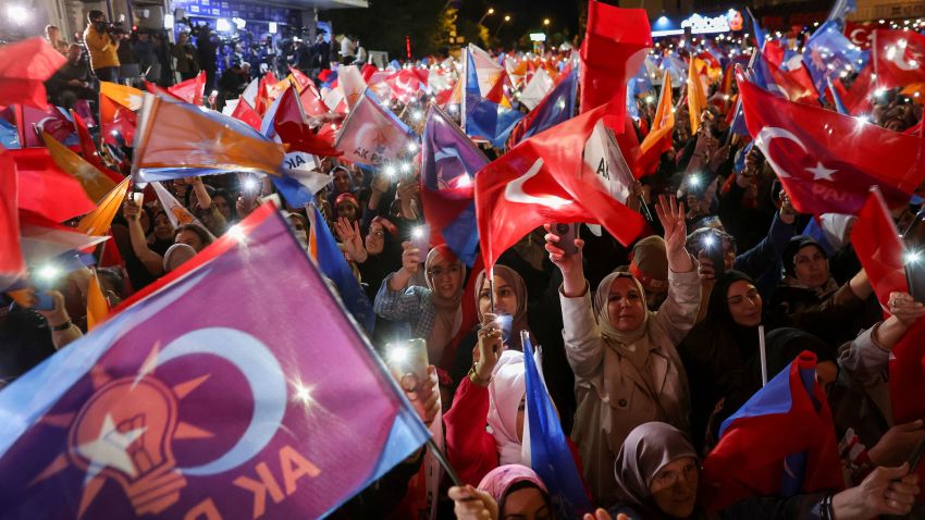 Supporters of Turkish President Tayyip Erdogan wave flags outside the AK Party headquarters in Ankara, Turkey, on May 15. Umit Bektas/Reuters