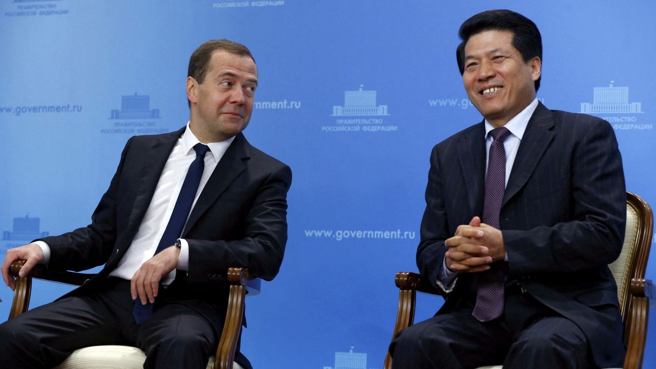 In this photo from 2015, Li Hui (right), now China's special representative for Eurasian affairs, sits with then-Russian Prime Minister Dmitry Medvedev at an event in Moscow. Li was China's ambassador to Russia from 2009-2019.