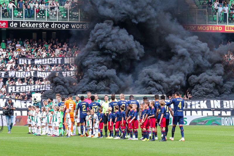 FC Groningen vs Ajax suspended due to fans throwing fireworks onto the pitch CNN