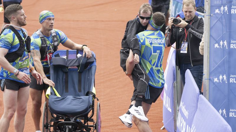 NextImg:Kevin Sinfield carries friend and former teammate Rob Burrow across marathon finish line | CNN