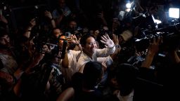 Move Forward Party leader and prime ministerial candidate Pita Limjaroenrat (C) leaves the party's headquarters as votes continue to be counted, during Thailand's general election in Bangkok on May 14, 2023. 