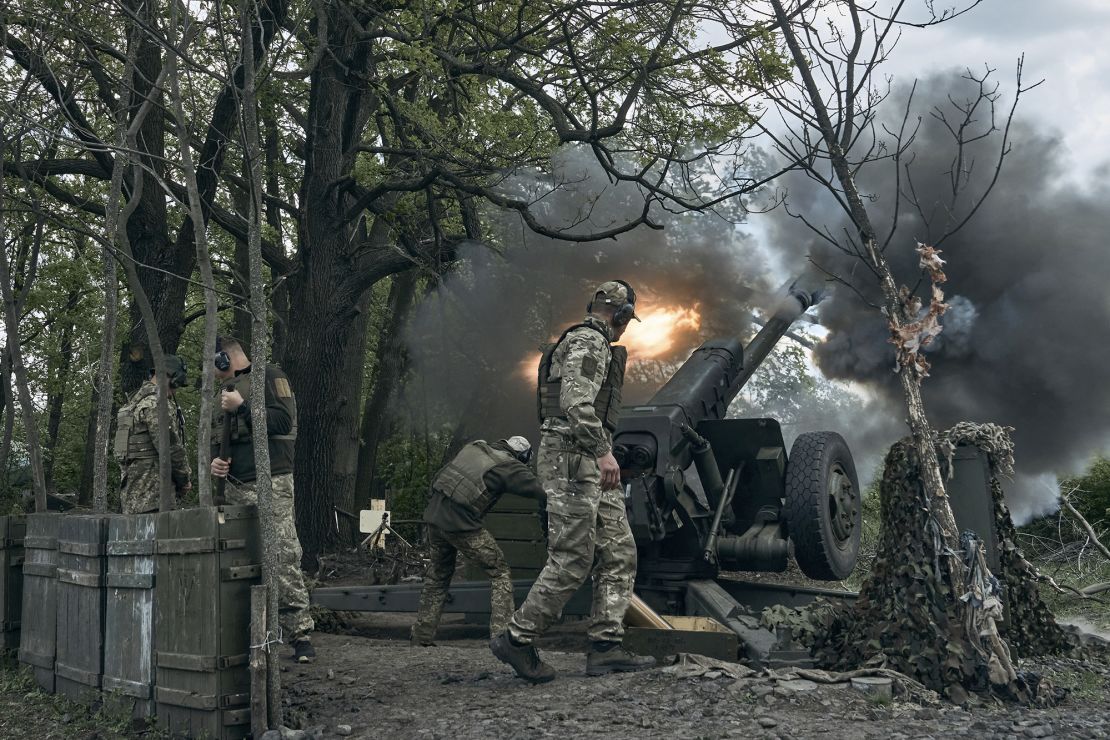 Ukrainian soldiers, pictured in Bakhmut on Friday, fire a cannon near the eastern city, where a fierce battle for control against Russian forces rages.