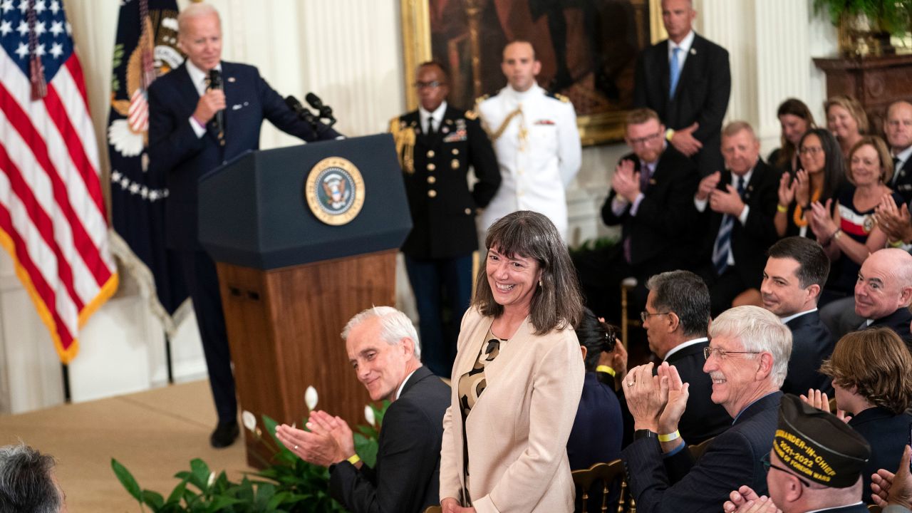 In this August 2022 photo, Monica Bertagnolli, newly appointed director of the National Cancer Institute, stands for recognition during remarks by President Joe Biden.