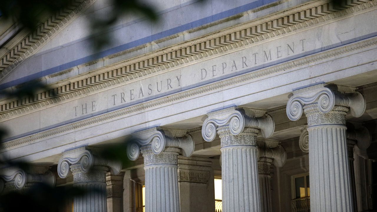 FILIE - This June 6, 2019, photo, shows the U.S. Treasury Department building at dusk in Washington.