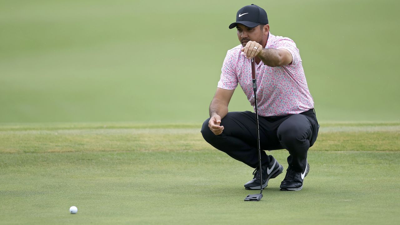 Day lines up a putt during his nine-under final round. 