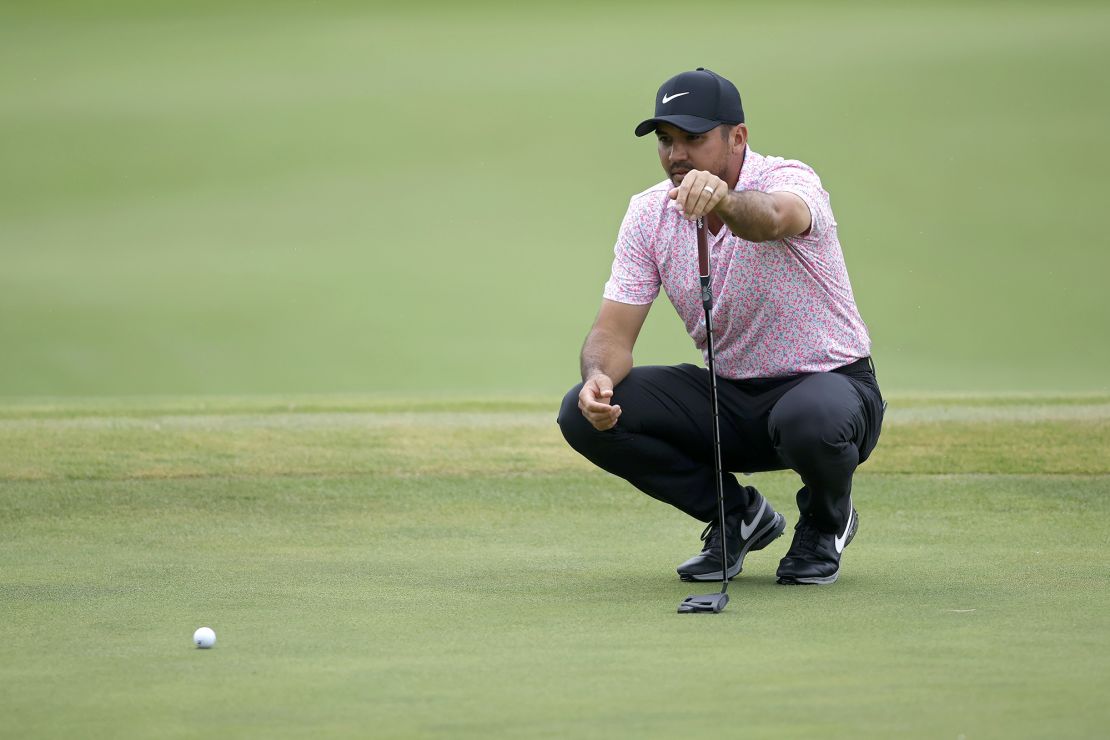 Day lines up a putt during his nine-under final round. 