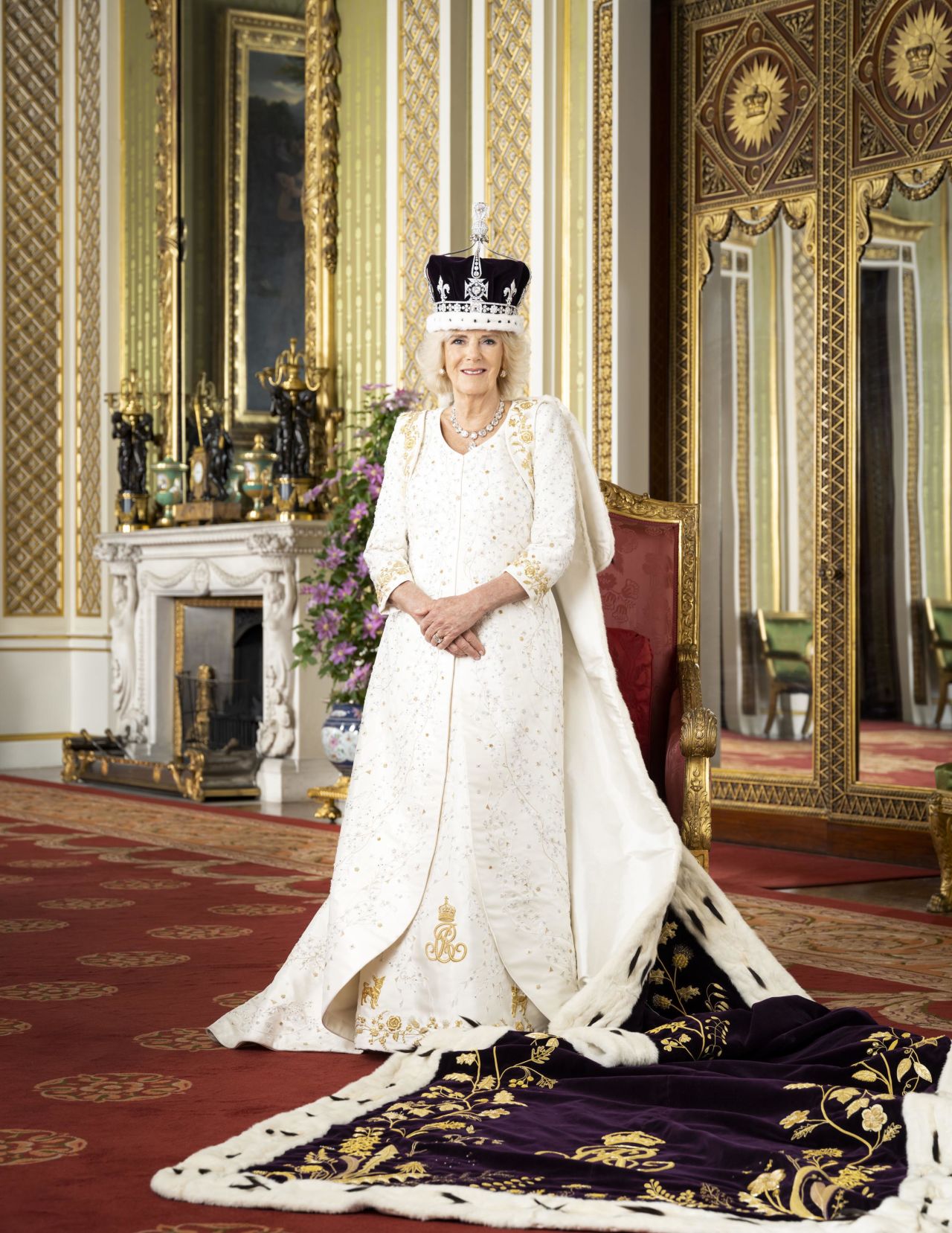 Camilla poses for a photo in Buckingham Palace's Green Drawing Room in May 2023.