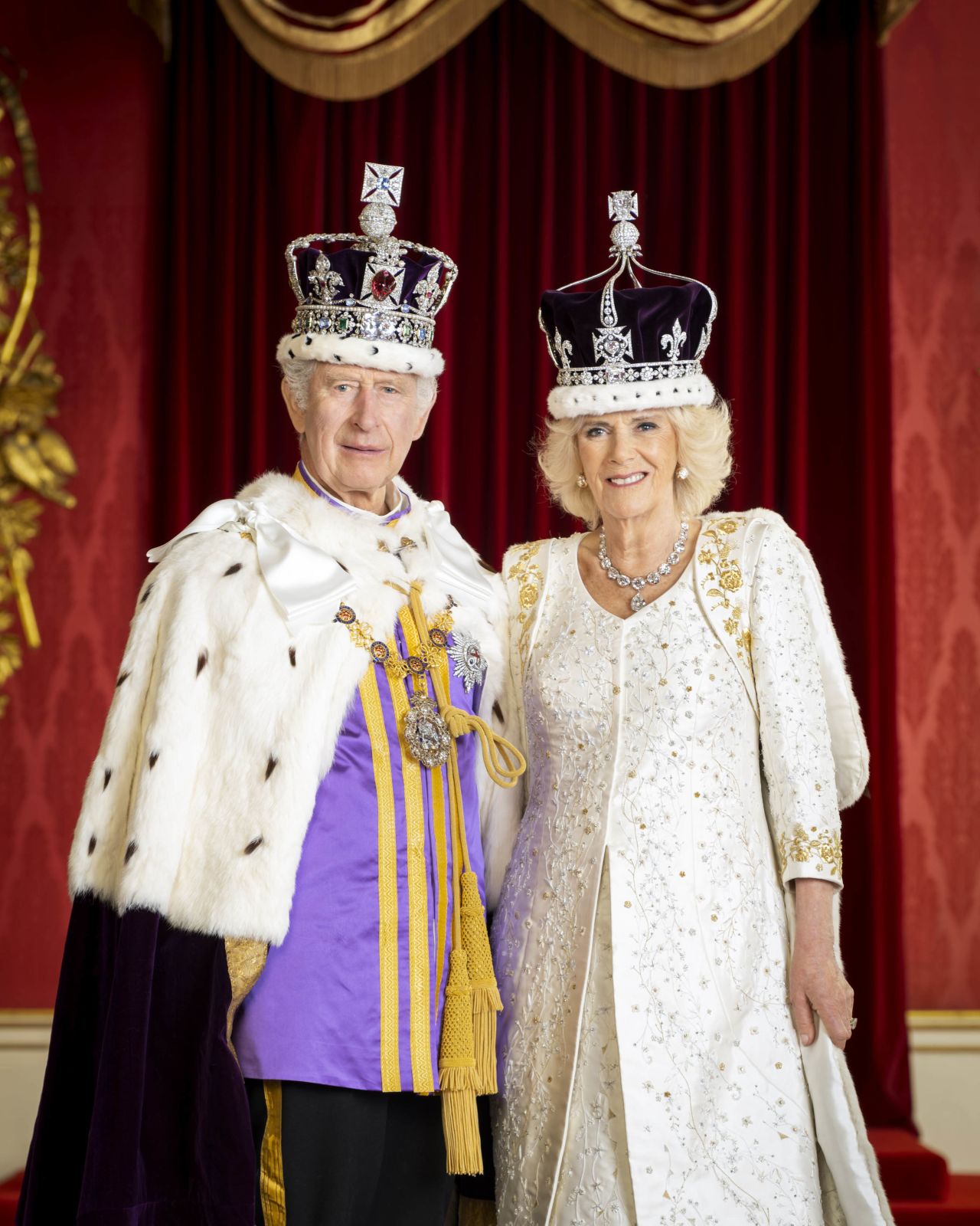 The King and Queen pose for a portrait in Buckingham Palace.