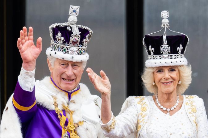 Britain's King Charles III and Queen Camilla wave from the balcony of Buckingham Palace after their <a href="index.php?page=&url=http%3A%2F%2Fwww.cnn.com%2F2023%2F05%2F06%2Fuk%2Fgallery%2Fcoronation-king-charles%2Findex.html" target="_blank">coronation ceremony</a> in May 2023.
