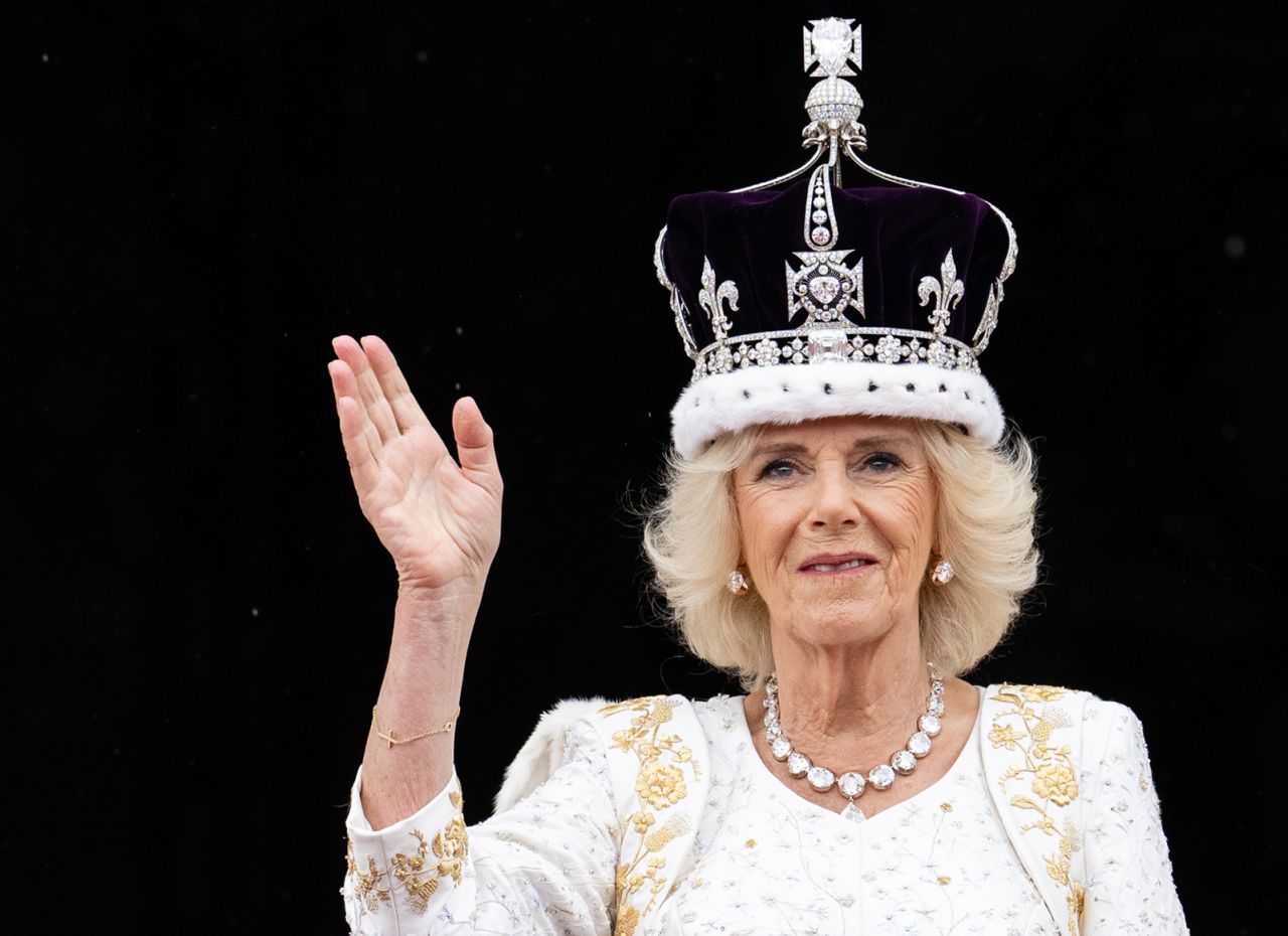 Britain's Queen Camilla waves from the balcony of Buckingham Palace after a <a href="http://www.cnn.com/2023/05/06/uk/gallery/coronation-king-charles/index.html" target="_blank">coronation ceremony</a> in May 2023.