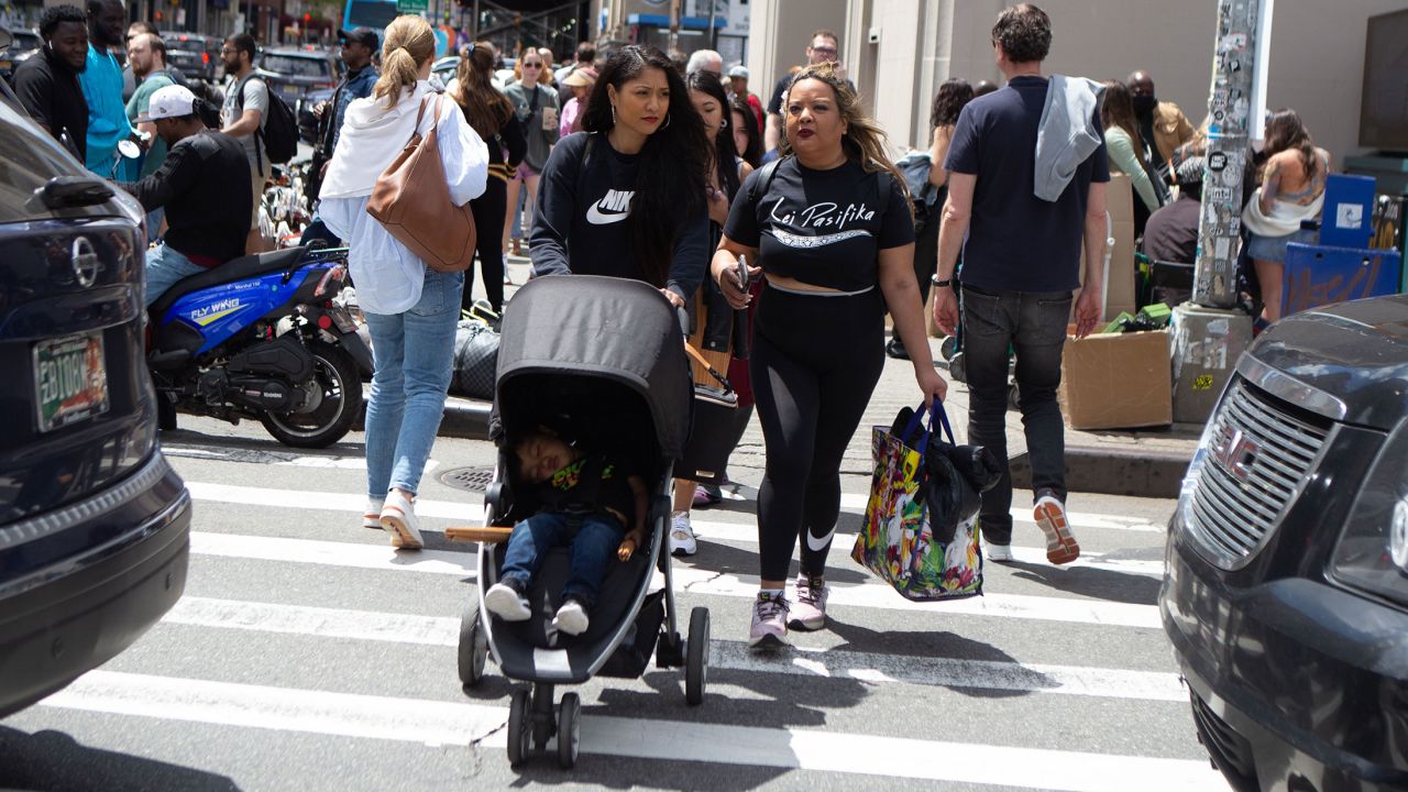 Lei Pasifika member Miyuki Daniels, left, of Brooklyn with her son, walks with Tamara Bejar Hernandez, right, to head to the subway station after practice. Daniels said she attended practice while pregnant with her son, who still accompanies her to the studio now.