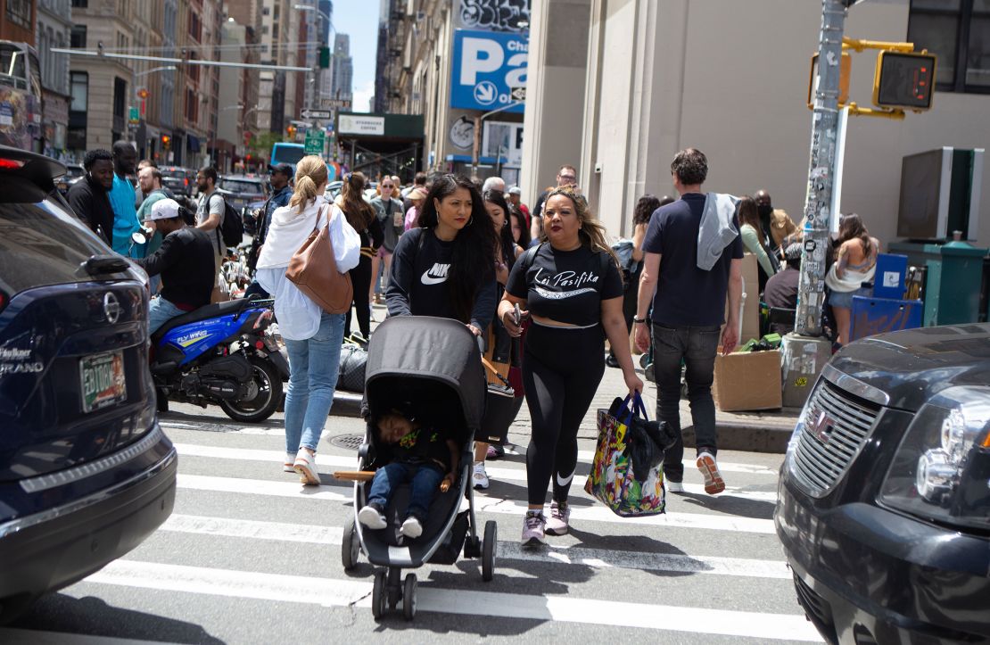 Lei Pasifika member Miyuki Daniels, left, of Brooklyn with her son, walks with Tamara Bejar Hernandez, right, to head to the subway station after practice. Daniels said she attended practice while pregnant with her son, who still accompanies her to the studio now. 