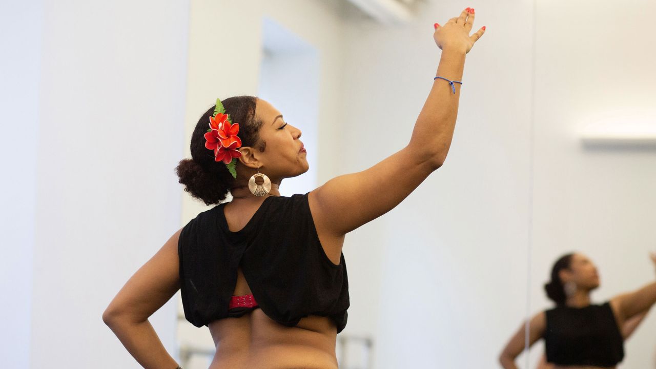 Linda Peralte practices her hand movement and dance in New York.
