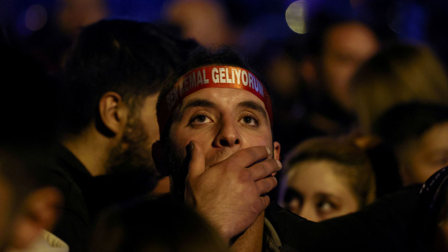 A supporter of Kemal Kilicdaroglu, presidential candidate of Turkey's main opposition alliance, reacts during a rally as voters await election results in Ankara on May 14, 2023. 